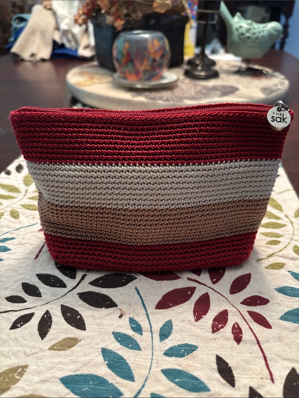 The Sak Crochet Stripe Cosmetic Pouch in Burgundy, cream & Tan